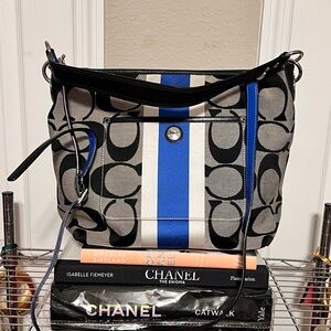 COACH Signature logo canvas shoulder bag with detachable long strap.